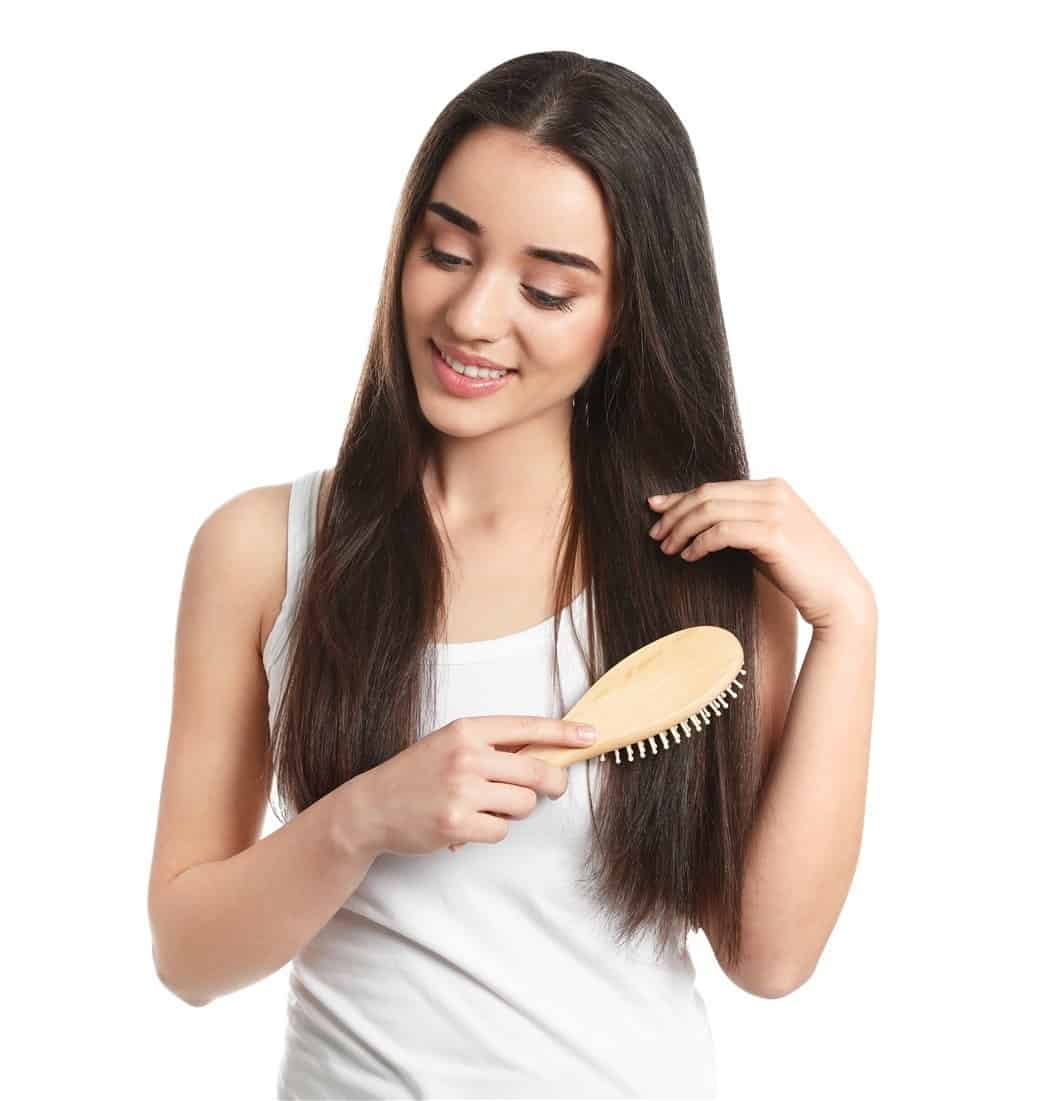 combing with wooden hair brush