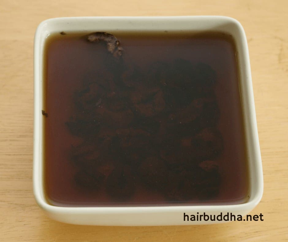 Dried amla pieces in water