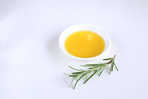 Castor oil hair mask in a white bowl. Hair treatment to promote hair growth.